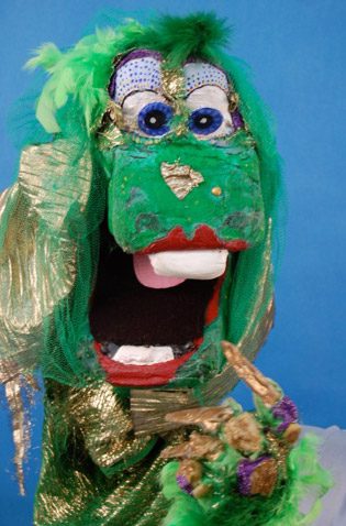 Sparkly green dragon puppet with open mouth