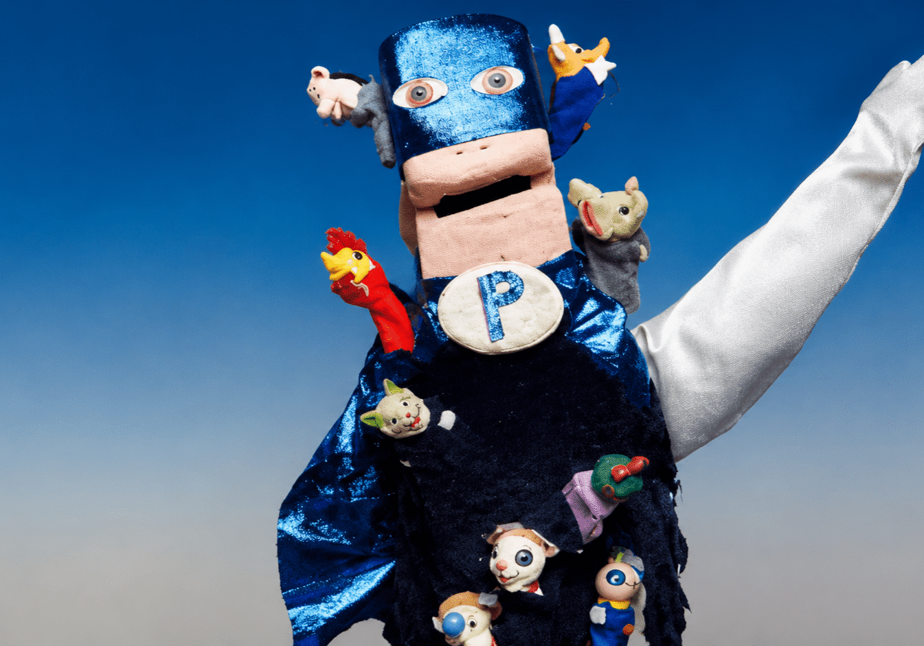 Colorful puppet superhero with raised arm