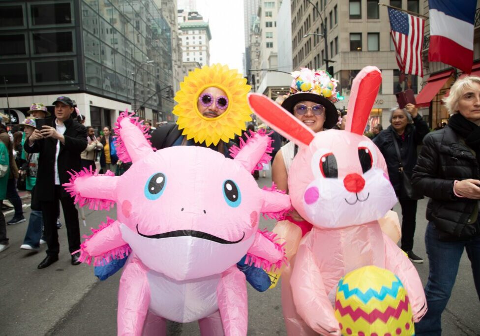 People in colorful inflatable costumes at parade